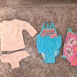 Three Carter's and Starting Out 3-6 Month Baby Girl Swimsuits. Worn Once.